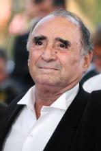 French actor Claude Brasseur poses upon arriving at the Festival Palace for the premiere of French director Rachid Bouchareb's film 'Indigenes' at the 59th edition of the International Cannes Film Fes