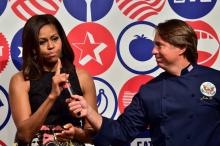 L'ancienne Première Dame Michelle Obama et le chef cuisinier John Besh à Milan le 17 juin 2015