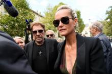 Johnny Hallyday et sa femme Laetitia Hallyday venus assister aux funéraillmes de Mireille Darc en l'